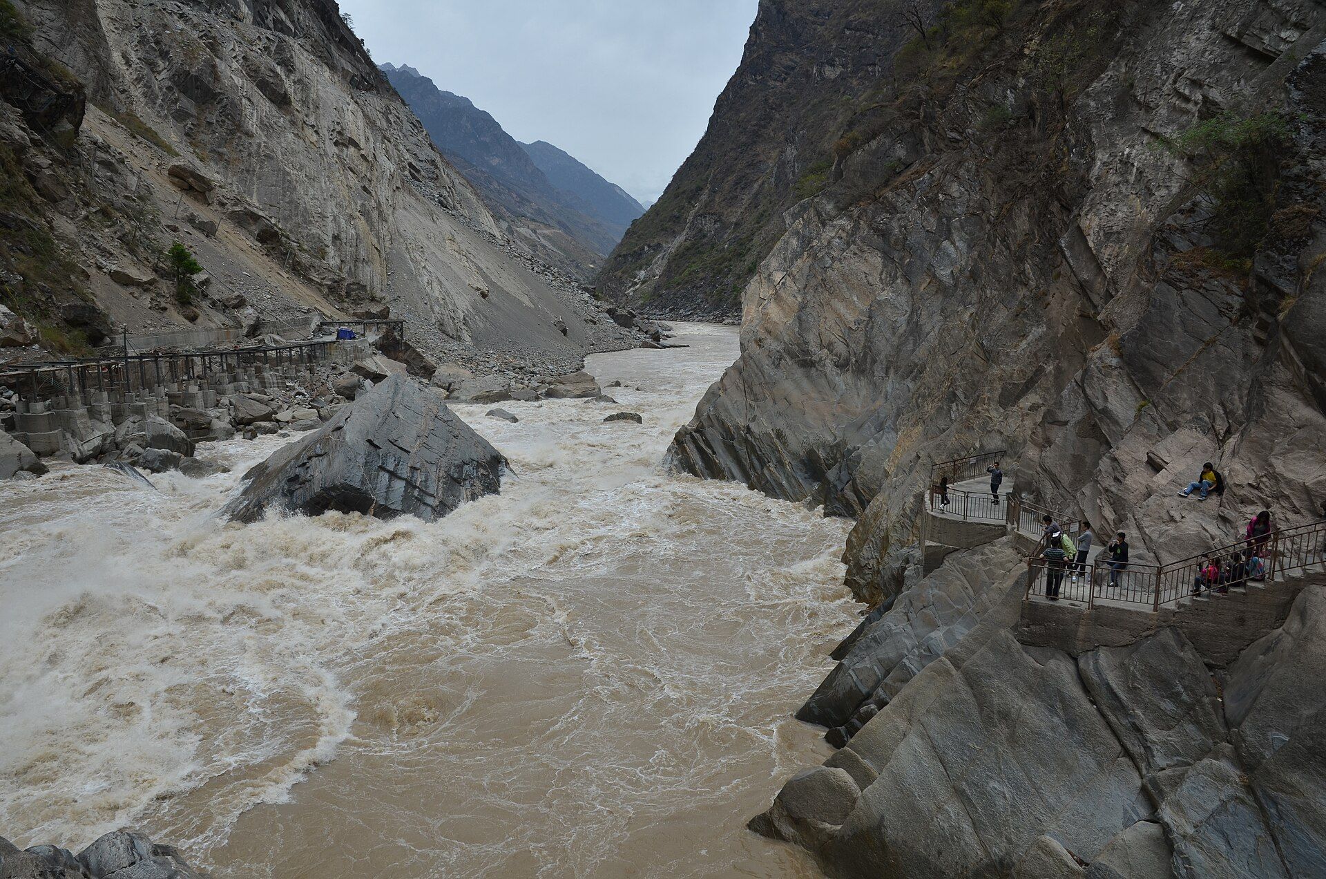 The Jinsha River roaring past the Tiger Leaping Stone between sheer cliffs